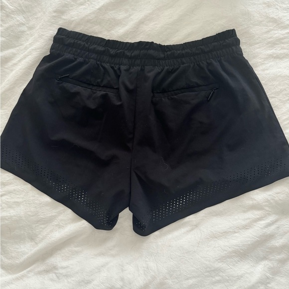 Athleta Baja Perforated Laser Cut Featherweight
Stretch Drawstring Shorts 4 - Picture 3 of 6